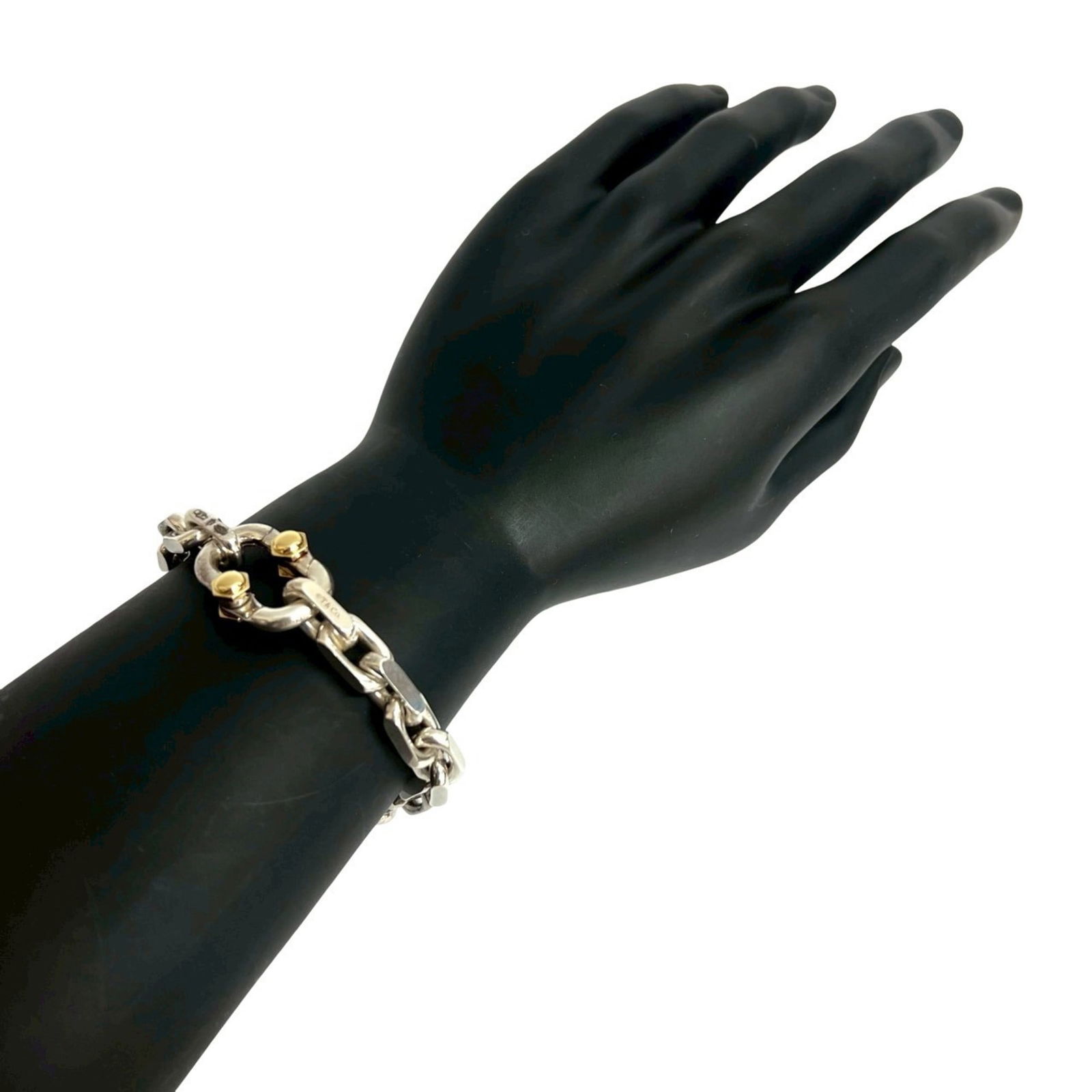 Tiffany Silver 925 Charm Bracelet with Yellow Gold (18K): Tiffany Silver 925 Charm Bracelet with Yellow Gold (18K) Tiffany Charm Bracelet crafted from Silver 925 and Yellow Gold (18K), measuring 20.7cm in length, in good used condition with visible traces of