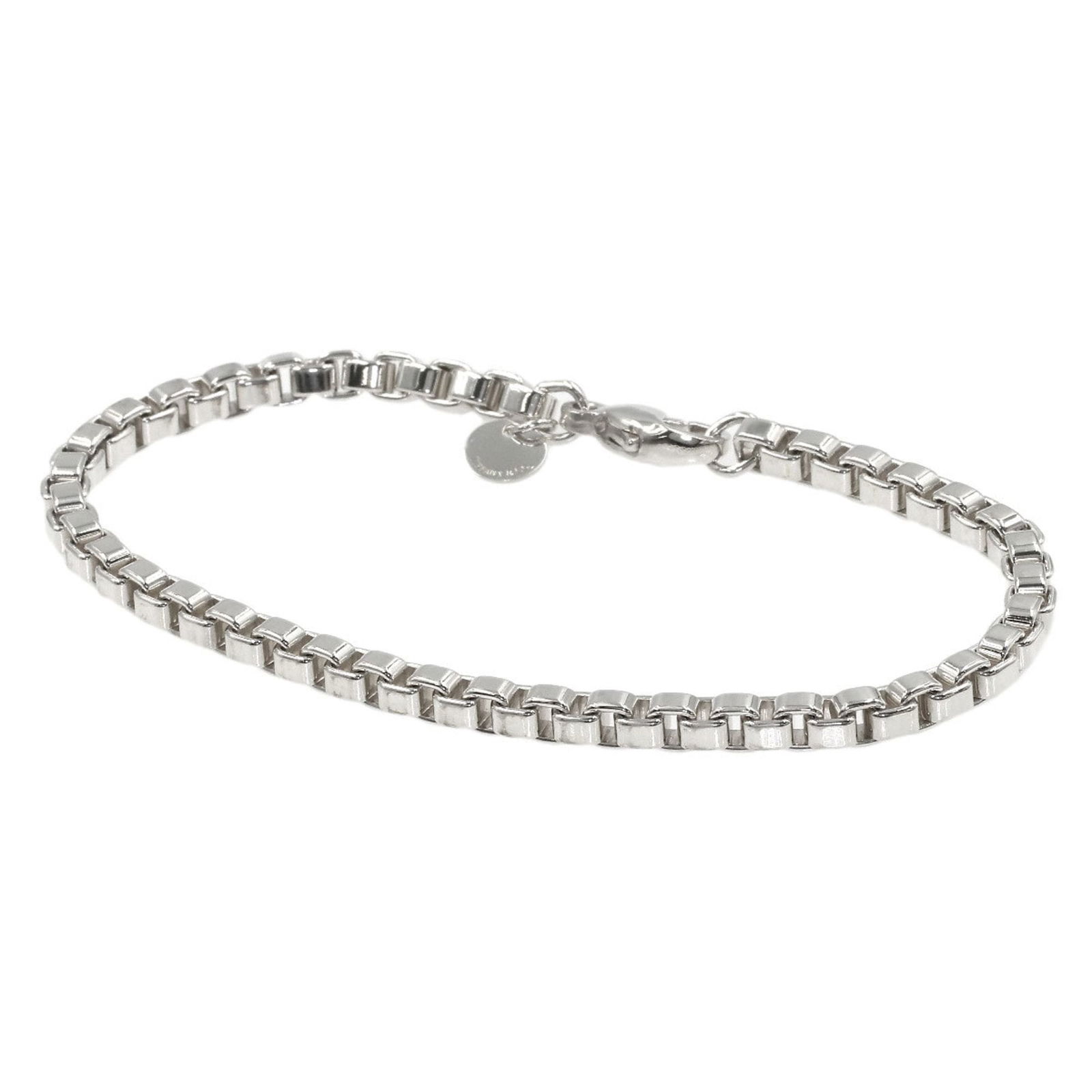 Silver Tiffany Charm Bracelet: Silver Tiffany Charm Bracelet Loose lab-grown diamond weighing 1.08ct, with an E color and VVS2 clarity, certified by GIA, featuring excellent polish and symmetry. Item Specifics: Brand: Tiffany Type: