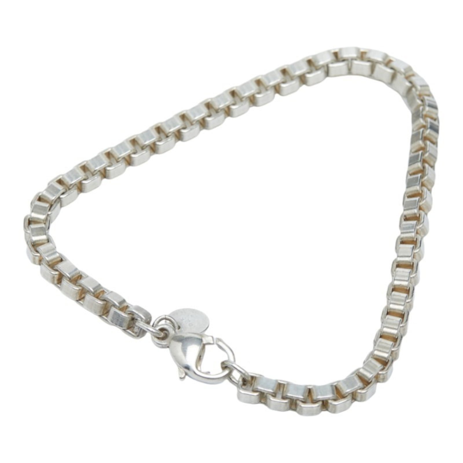 Tiffany Silver 925 Charm Bracelet: Tiffany Silver 925 Charm Bracelet Tiffany Silver 925 Charm Bracelet designed for women, measuring 17.5 cm in length. Condition: Used (good) with traces of usage. Item Specifics: Brand: Tiffany Type: C
