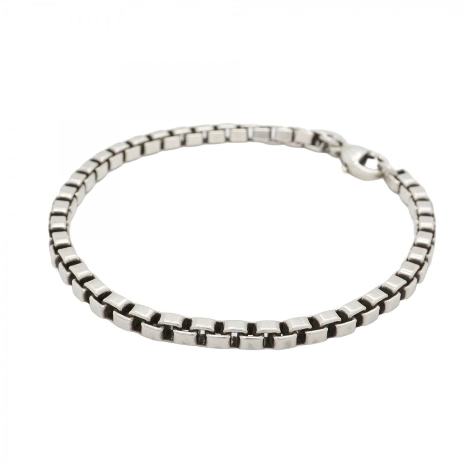 Tiffany Silver 925 Charm Bracelet: Tiffany Silver 925 Charm Bracelet Tiffany & Co. charm bracelet made of silver 925, with a length of 18cm, designed for women. It is in good condition with visible signs of usage. Item Specifics: Brand