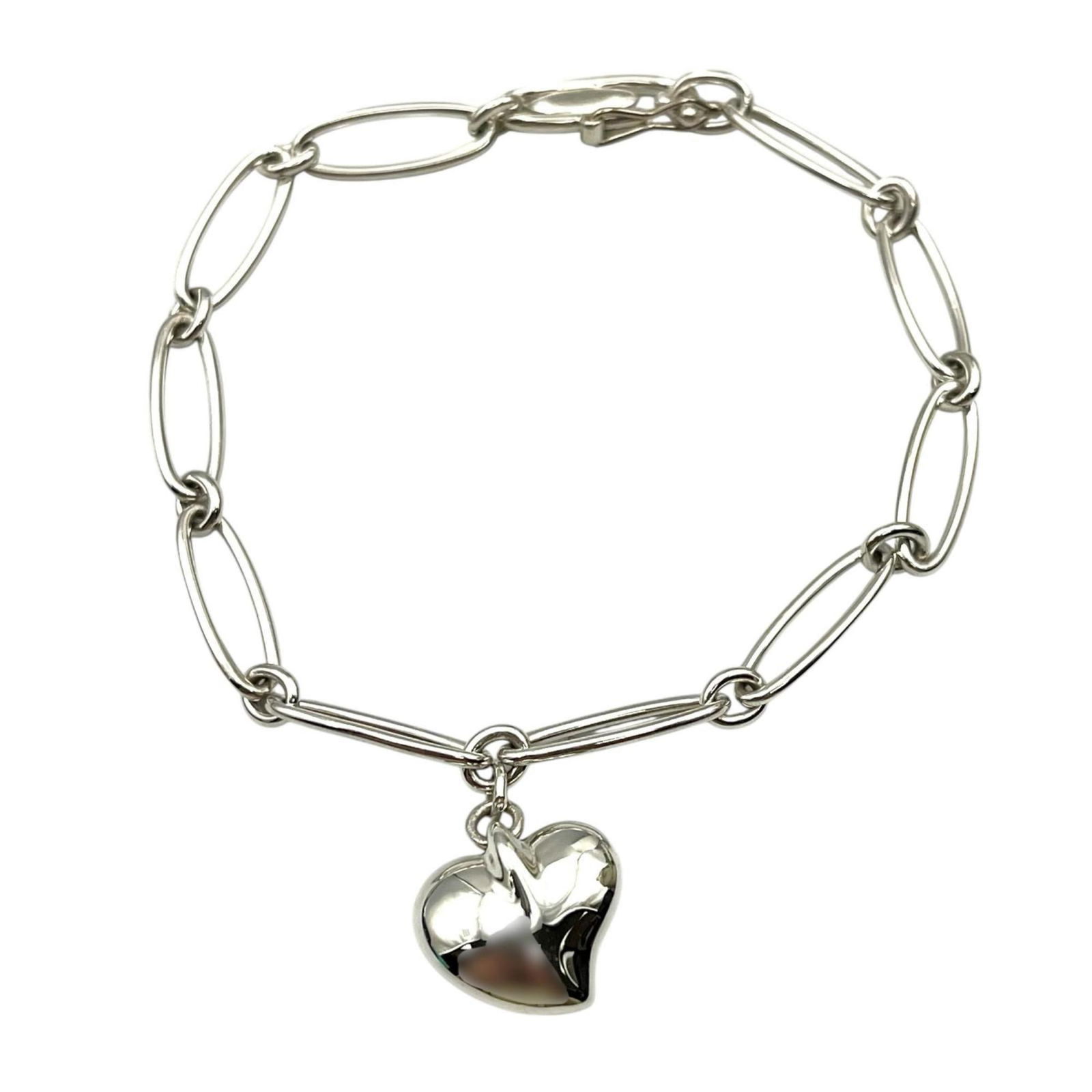 Tiffany Silver 925 Charm Bracelet: Tiffany Silver 925 Charm Bracelet Tiffany Silver 925 charm bracelet, measuring 8.5cm in length, used in good condition with visible traces of usage. Item Specifics: Brand: Tiffany Type: Charm Bracelet