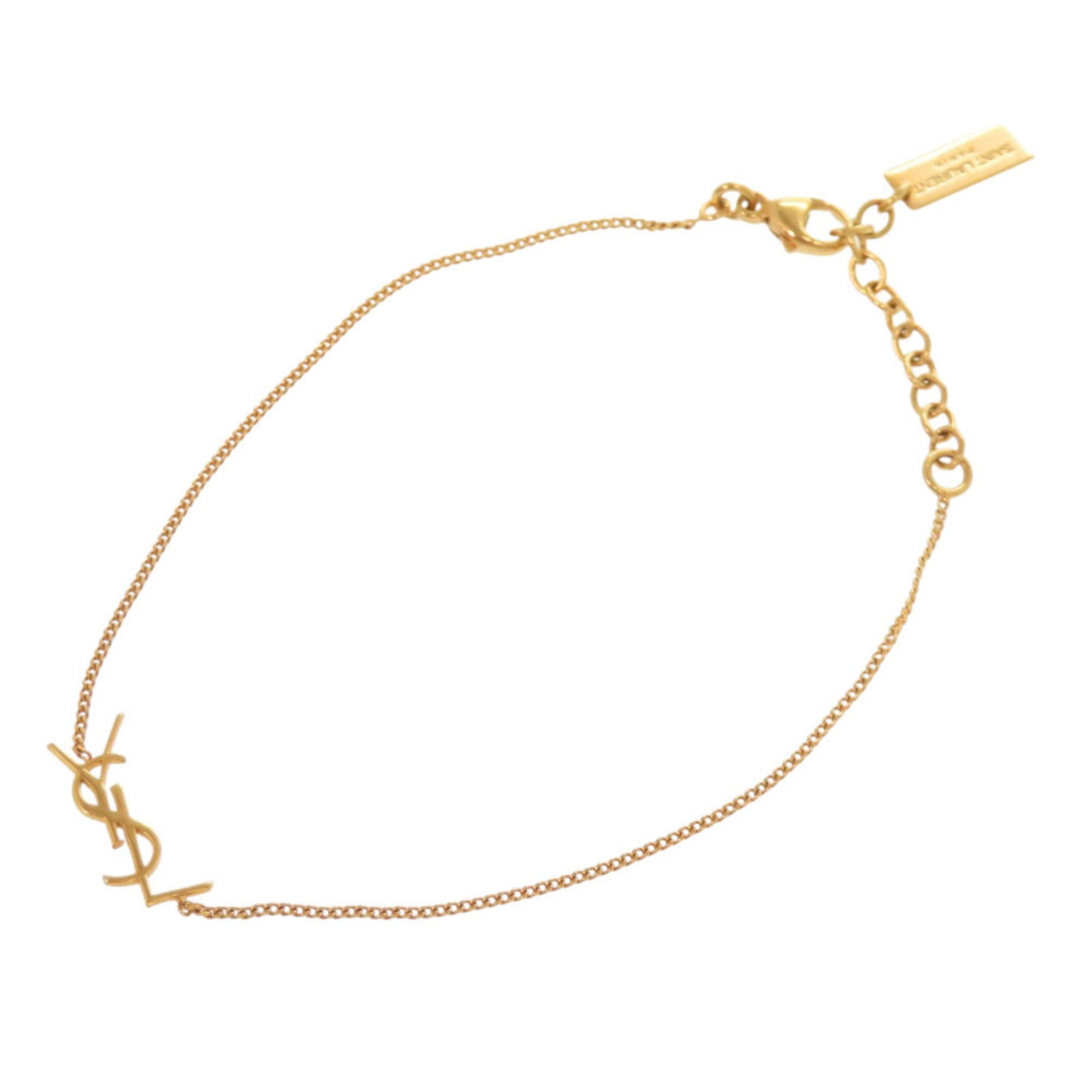 Yves Saint Laurent Metal Charm Bracelet: Yves Saint Laurent Metal Charm Bracelet Yves Saint Laurent Metal Charm Bracelet for women, crafted from gold colored metal, measuring 20cm (7.87 inches) in length, in very good used condition with min