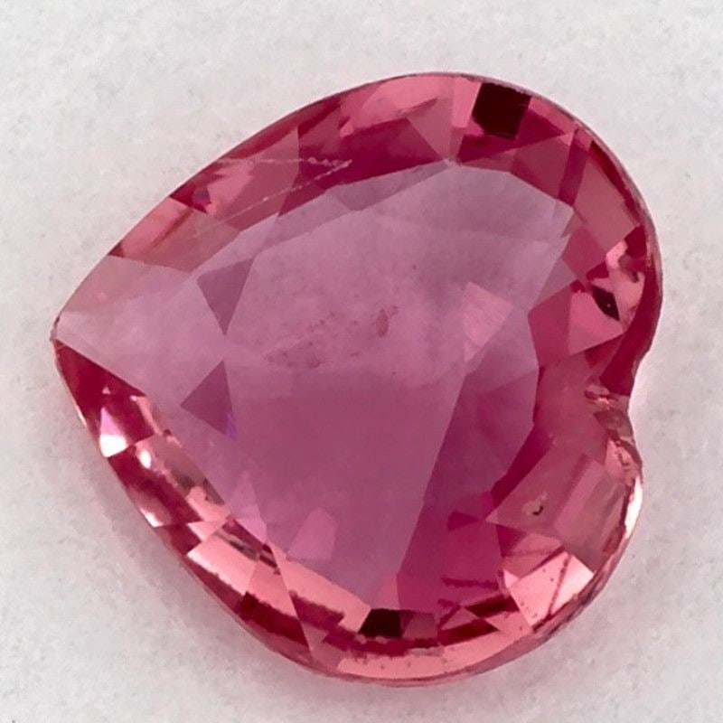Loose Sapphire Gemstone Heart 1.15ct Pink SI: Loose Sapphire Gemstone Heart 1.15ct Pink SI The loose sapphire gemstone weighs 1.15 carats, is heated, features a pink color with a faceted cut, and measures 7.36L x 7.28W, without certification. 