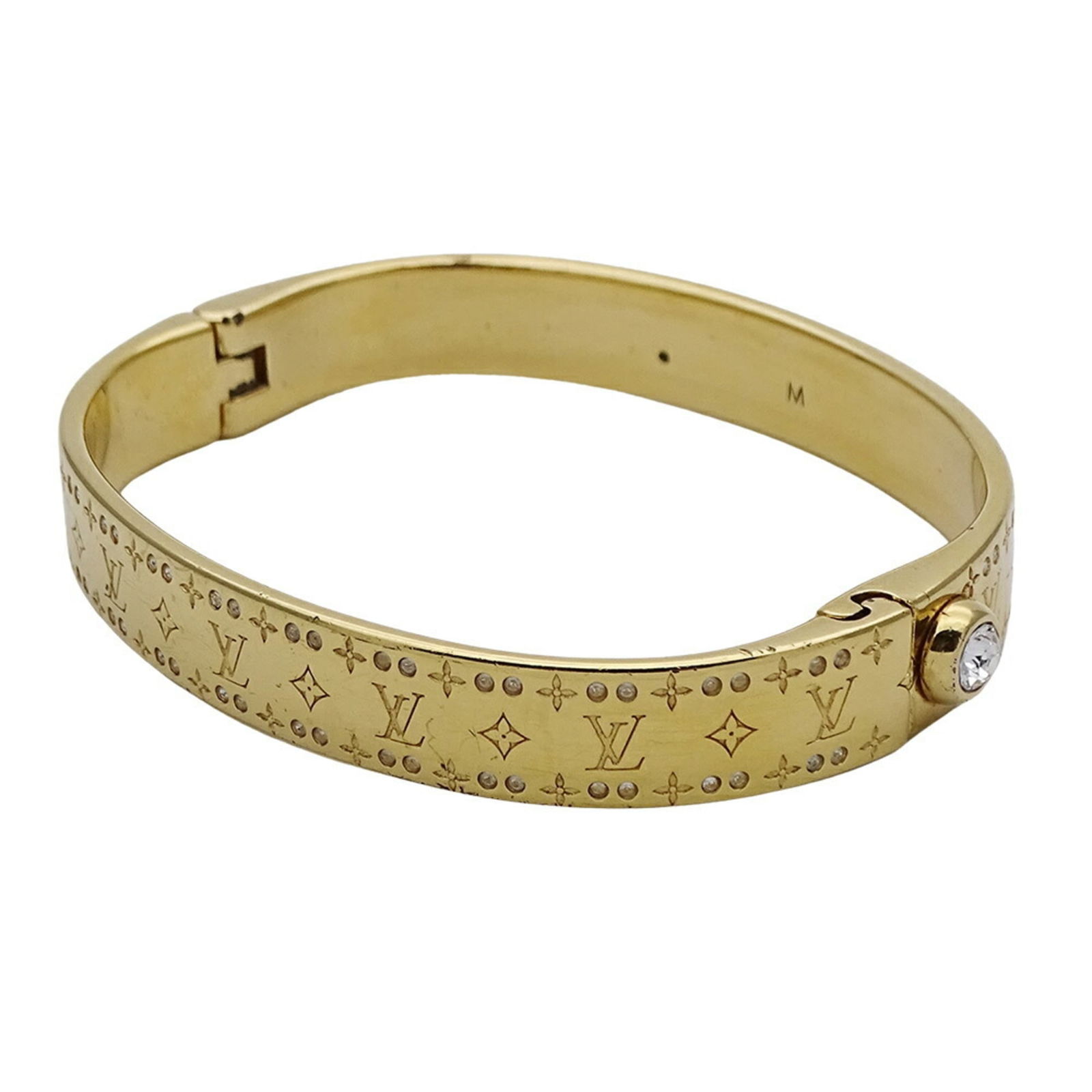 Louis Vuitton Metal Charm Bracelet: Louis Vuitton Metal Charm Bracelet Louis Vuitton charm bracelet made of metal in gold color, measuring 17cm, in acceptable condition with visible traces of usage and damages. Item Specifics: Brand: