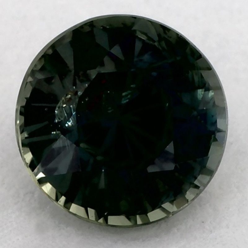 Loose Round 1.02ct Green SI Sapphire Gemstone: Loose Round 1.02ct Green SI Sapphire Gemstone Loose green sapphire gemstone weighing 1.02 carats, faceted cut, SI clarity, no treatment, and measurements of 5.71L x 5.71W mm. Certification: None. 