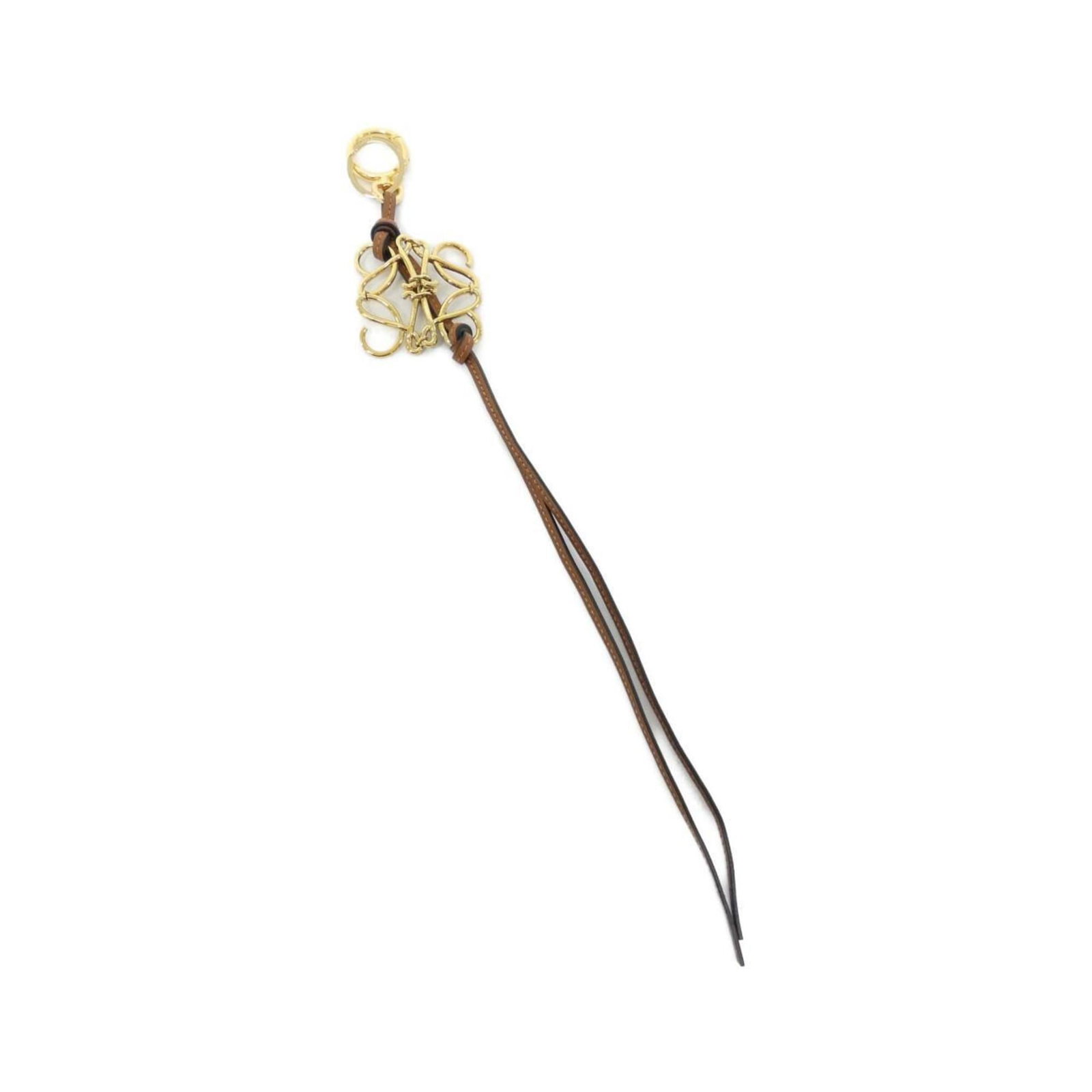 Leather Loewe Handbag Charm: Leather Loewe Handbag Charm Leather handbag charm from Loewe in brown and gold, in very good used condition with some traces of usage. Item Specifics: Brand: Loewe Type: Handbag Charm Gender: Women Ma