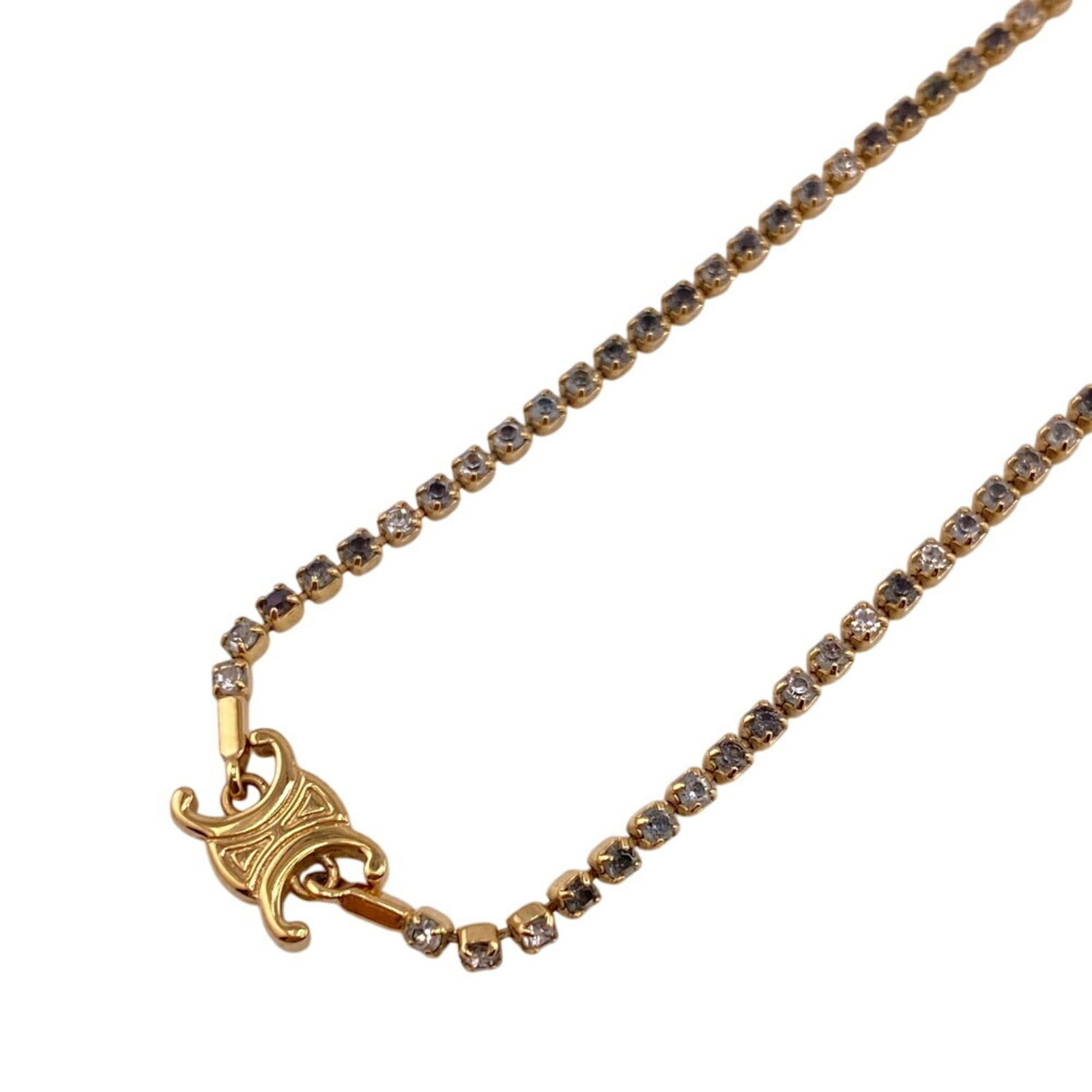 Celine Metal Rhinestone: Celine Metal Rhinestone Celine metal rhinestone necklace for women, gold in color, with a neck circumference of 42.5 cm; condition is used (very good) with minor signs of wear. Item Specifics: Brand:
