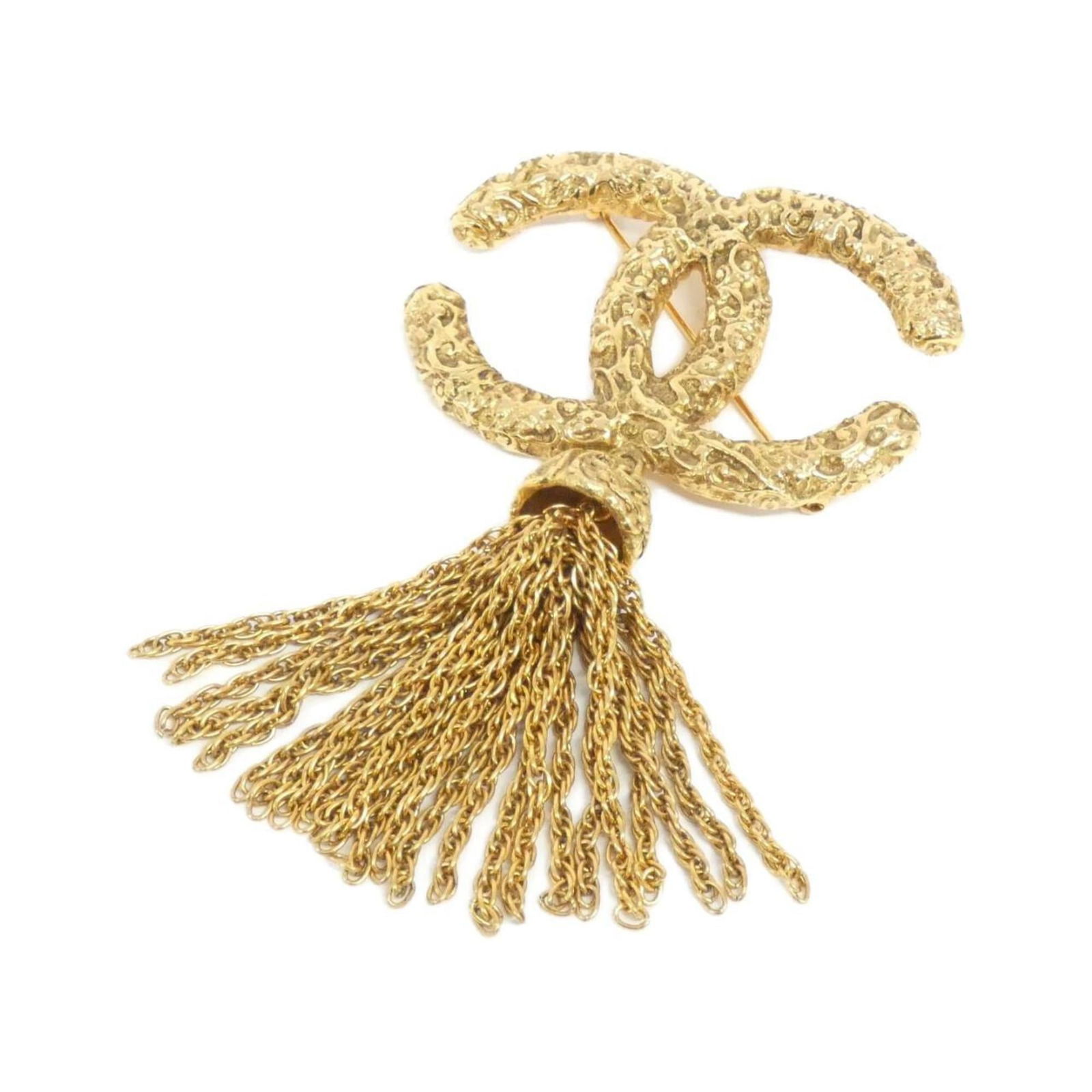 Brooch Chanel: Brooch Chanel Chanel gold brooch suitable for men, women, and unisex, measuring 5.2cm x 9cm, in very good used condition with a few traces of usage. Item Specifics: Brand: Chanel Type: Brooch Gender: