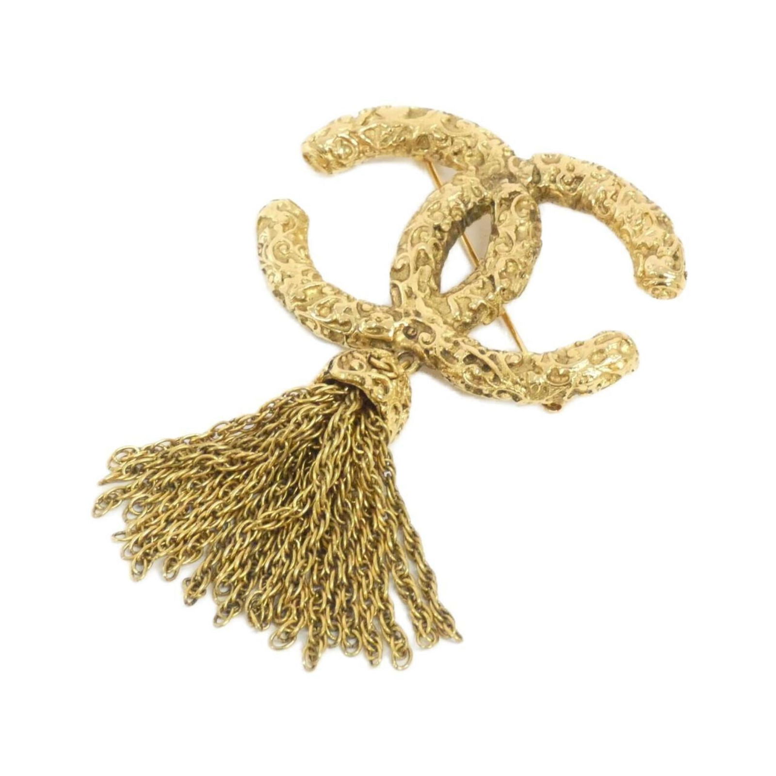 Brooch Chanel: Brooch Chanel Chanel gold brooch designed for women, measuring 8.5 cm x 5.3 cm, in used condition with traces of usage and damages. Item Specifics: Brand: Chanel Type: Brooch Gender: Women Color: Gold