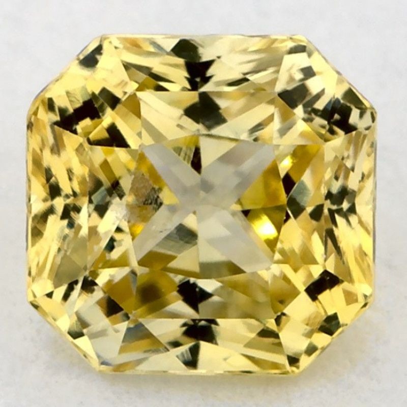 Loose Sapphire Gemstone 1.7ct Yellow EC - Radiant: Loose Sapphire Gemstone 1.7ct Yellow EC - Radiant This loose 1.7ct yellow sapphire gemstone features a faceted cut with EC clarity, heated treatment, and measures 6.35mm x 6.19mm. Item Specifics: