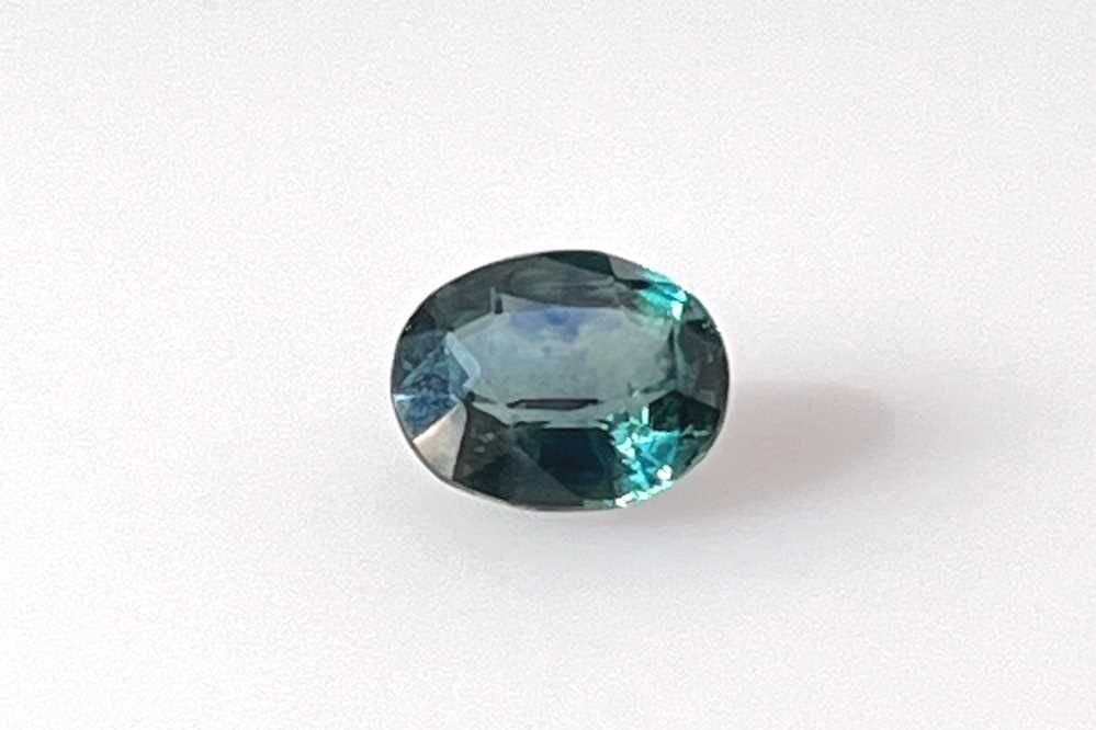 GIA Oval 2.0ct Teal EC Loose Sapphire Gemstone: GIA Oval 2.0ct Teal EC Loose Sapphire Gemstone This GIA-certified oval teal sapphire gemstone weighs 2.0 carats, is faceted with vivid multi-color shades, and has measurements of 8.13L x 6.86W. Item