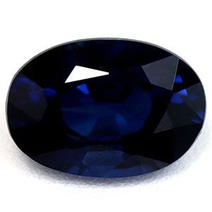 Loose Sapphire Gemstone Oval 1.07ct Blue SI: Loose Sapphire Gemstone Oval 1.07ct Blue SI Loose sapphire gemstone weighing 1.07ct with a deep blue color and SI clarity, featuring a faceted cut and heated treatment. Measurements are 7.01L x 4.94W