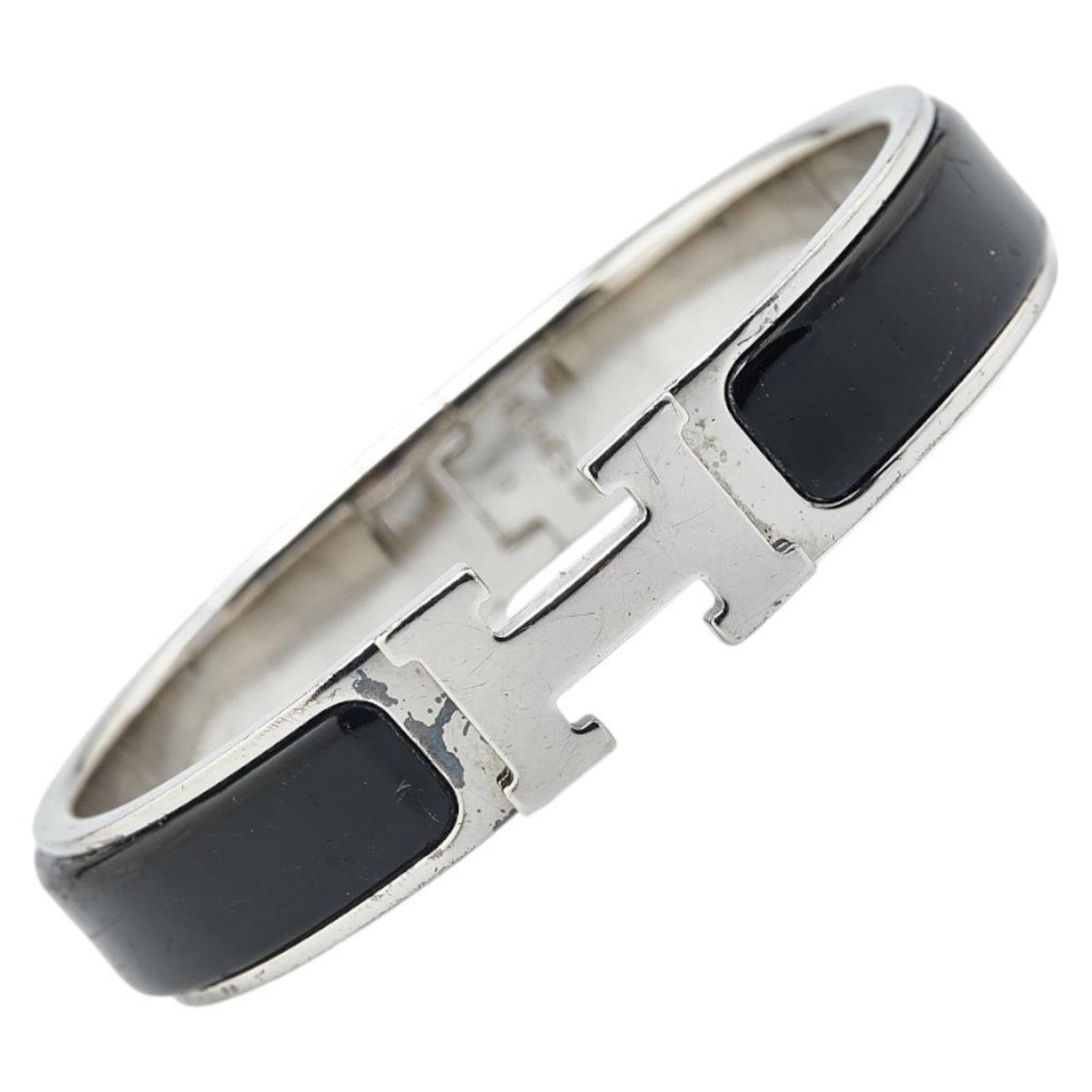 Metal Bangle - Hermes: Metal Bangle - Hermes Hermes bangle made of metal in black and silver colors, measuring 16cm in length; used condition with traces of usage. Item Specifics: Brand: Hermes Type: Bangle Gender: Women Ma