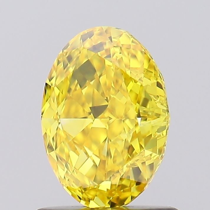 Loose Lab Diamond IGI Oval 1.02ct Fancy Vivid Yellow VVS2: Loose Lab Diamond IGI Oval 1.02ct Fancy Vivid Yellow VVS2 Loose lab-grown diamond oval cut at 1.02ct, fancy vivid yellow color, VVS2 clarity, certified by IGI, measuring 7.25L x 5.19W x 3.37H. Item