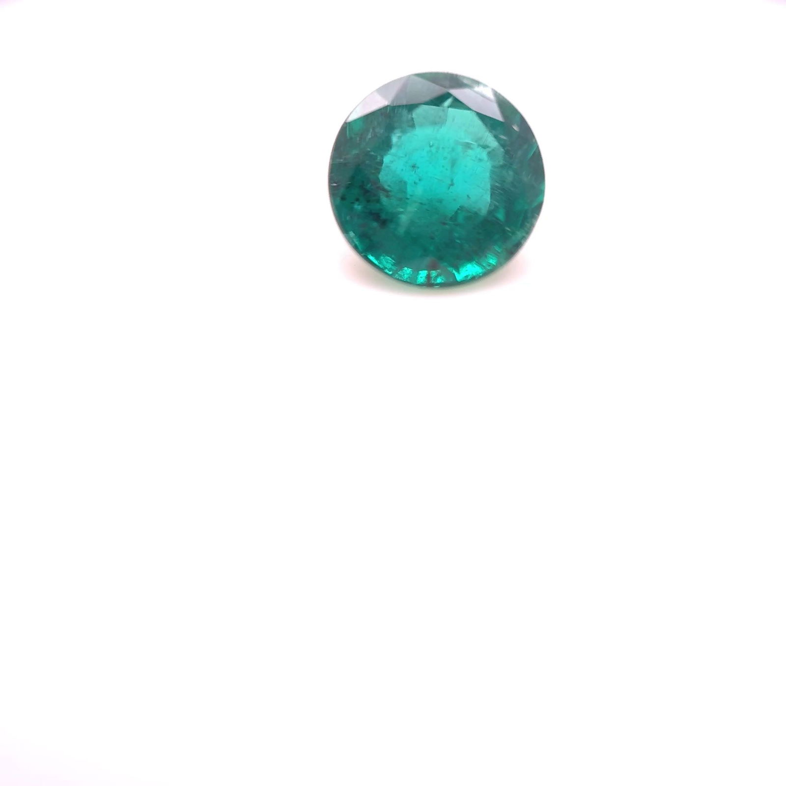 Loose Emerald Gemstone Round 1.43ct Green MI: Loose Emerald Gemstone Round 1.43ct Green MI Loose Emerald gemstone, round shape, weighing 1.43ct, vivid medium green color with MI clarity; no certification available. Item Specifics: Type: Emerald