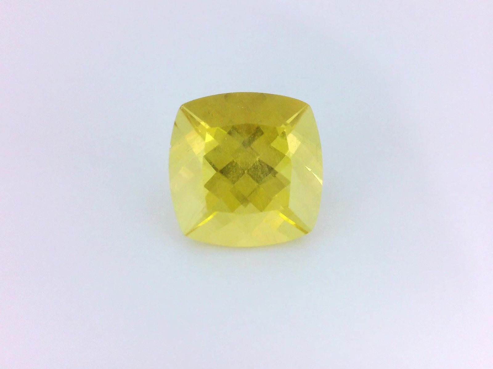 Loose Heliodor Gemstone GSI Cushion 4.64ct Yellow SI: Loose Heliodor Gemstone GSI Cushion 4.64ct Yellow SI Loose heliodor gemstone, GSI certified, weighing 4.64 ct, with a cushion cut, medium intense orangy yellow color, and SI clarity. Measurements are