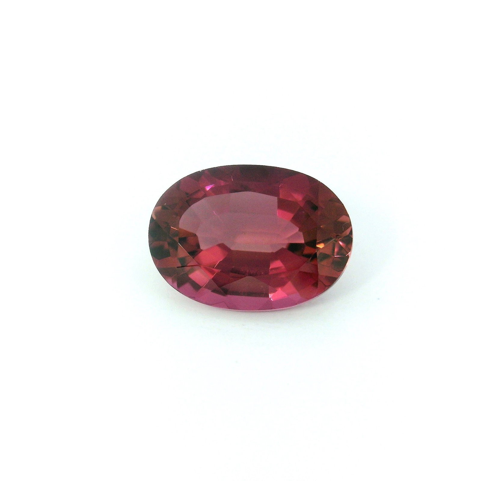 Loose GSI Oval 2.81ct Pink EC Tourmaline Gemstone: Loose GSI Oval 2.81ct Pink EC Tourmaline Gemstone Loose GSI Oval 2.81ct pink tourmaline gemstone in a faceted cut, exhibiting EC clarity and heated treatment, measuring 10.69L x 7.68W mm. Item