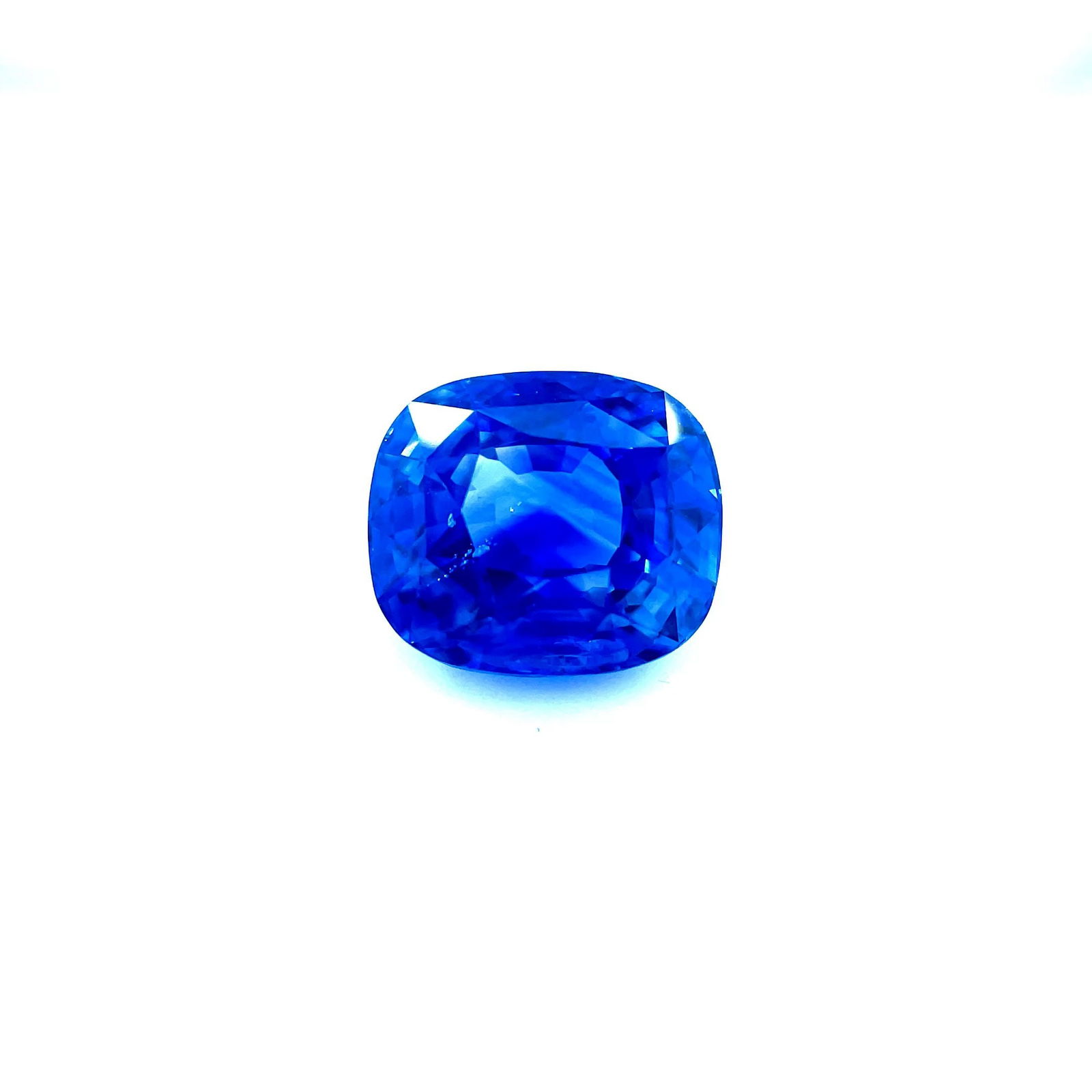Loose Sapphire Gemstone Cushion 4.52ct Blue EC: Loose Sapphire Gemstone Cushion 4.52ct Blue EC Loose cushion-cut sapphire gemstone weighing 4.52 ct in vivid blue color, with no treatment and EC clarity, measuring 9.52 x 8.27 mm; certified by other.