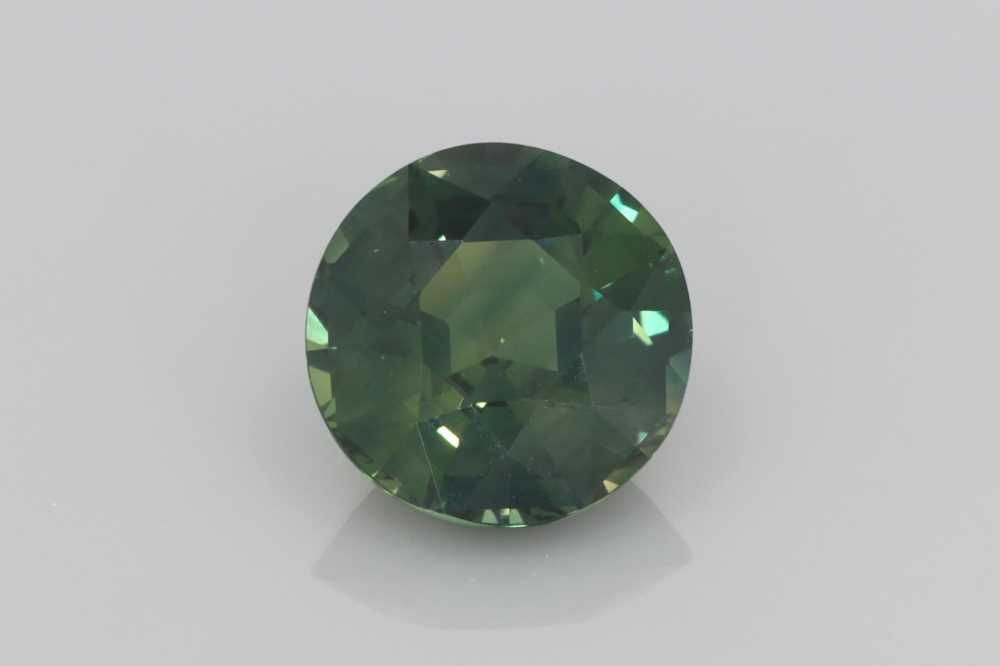 Loose Sapphire Gemstone Round 3.01ct Teal EC: Loose Sapphire Gemstone Round 3.01ct Teal EC Loose sapphire gemstone weighing 3.01ct with a vivid multi-color teal shade, faceted cut, and EC clarity. Item Specifics: Type: Sapphire Carat: 3.01 Cut: