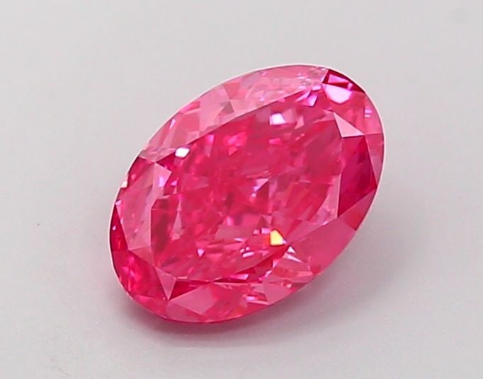 Loose Lab Diamond 1.05ct Fancy Vivid Pink VS1 - IGI Oval: Loose Lab Diamond 1.05ct Fancy Vivid Pink VS1 - IGI Oval Loose lab-created diamond of 1.05ct, oval cut, fancy vivid pink color, VS1 clarity, with excellent polish and symmetry, certified by IGI. 