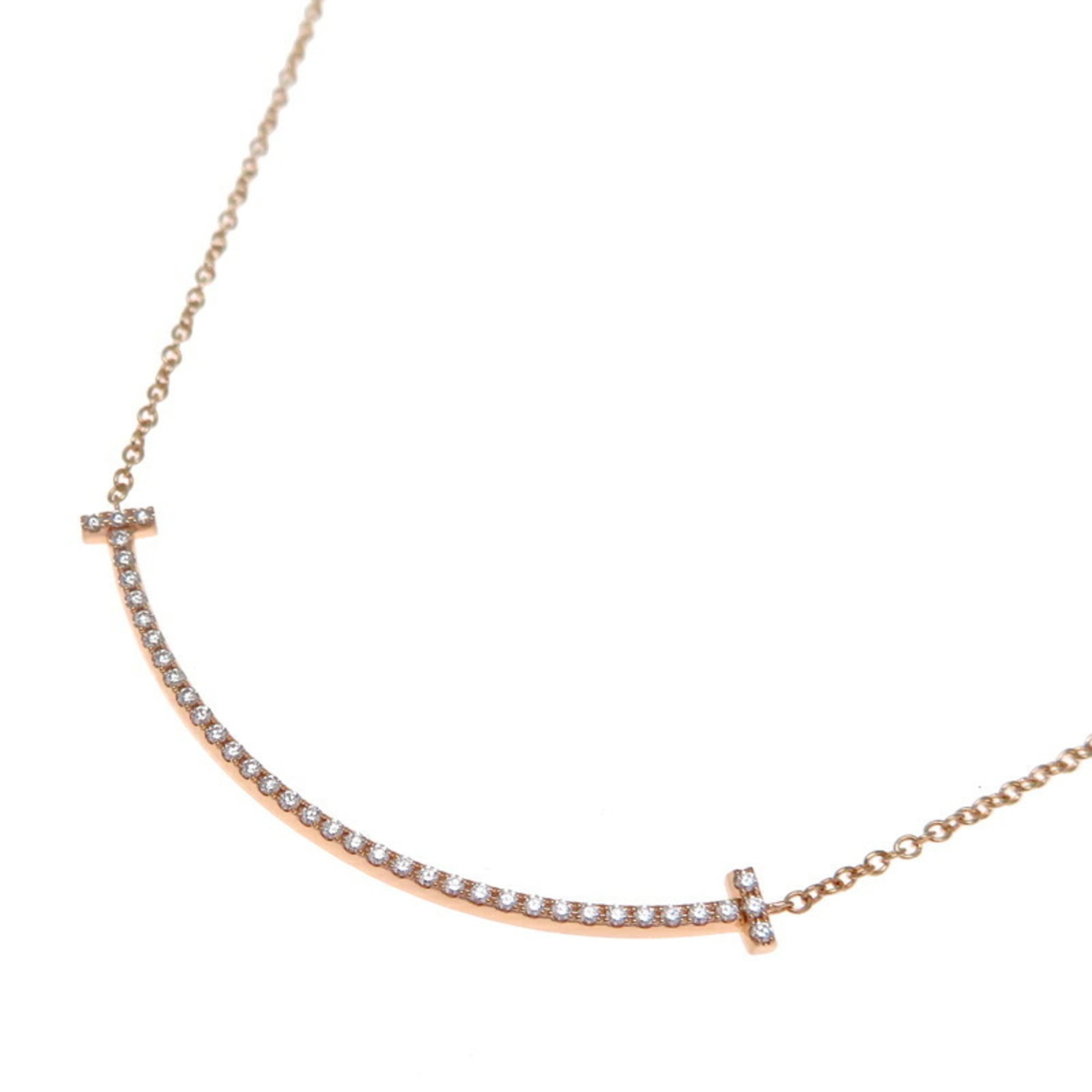 Pink Gold (18K) Tiffany: Pink Gold (18K) Tiffany This 18K Pink Gold necklace from Tiffany features a diamond, weighs 2.1g, and has a neck circumference of 41 cm; it is in very good used condition with minor traces of wear. 