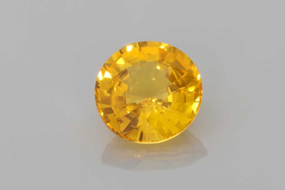 Loose Sapphire Gemstone Round 2.02ct Yellow EC: Loose Sapphire Gemstone Round 2.02ct Yellow EC This 2.02ct round yellow sapphire features a faceted cut, is heated for treatment, and has a deep yellow shade with EC clarity, certified by OTHER. 