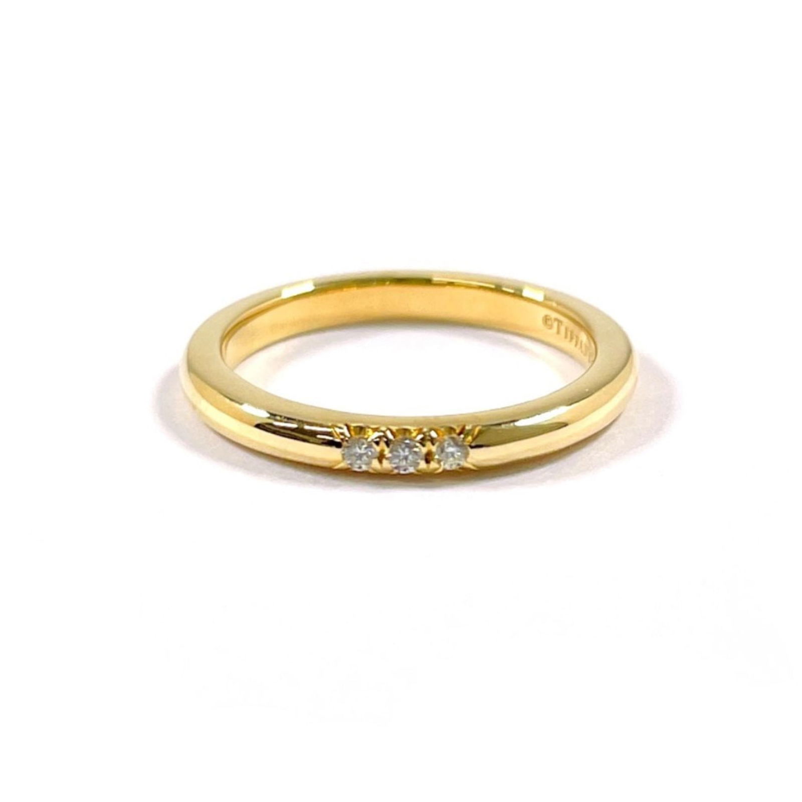 18K Yellow Gold Tiffany Band Ring: 18K Yellow Gold Tiffany Band Ring 18K yellow gold band ring by Tiffany, size 2.5, in like-new condition with hardly any traces of usage. Item Specifics: Brand: Tiffany Type: Band Ring Gender: Women