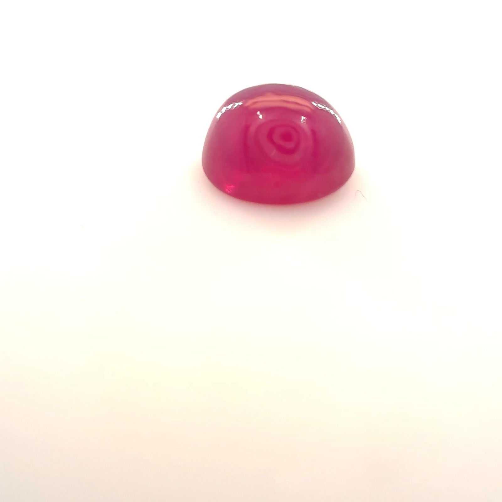 Loose Ruby Gemstone Oval 1.32ct Red MI: Loose Ruby Gemstone Oval 1.32ct Red MI Loose Ruby gemstone weighing 1.32ct, with a cabochon cut, red color, and MI clarity; heated treatment with medium shade and dimensions of 6.18L x 5.11W, no certi