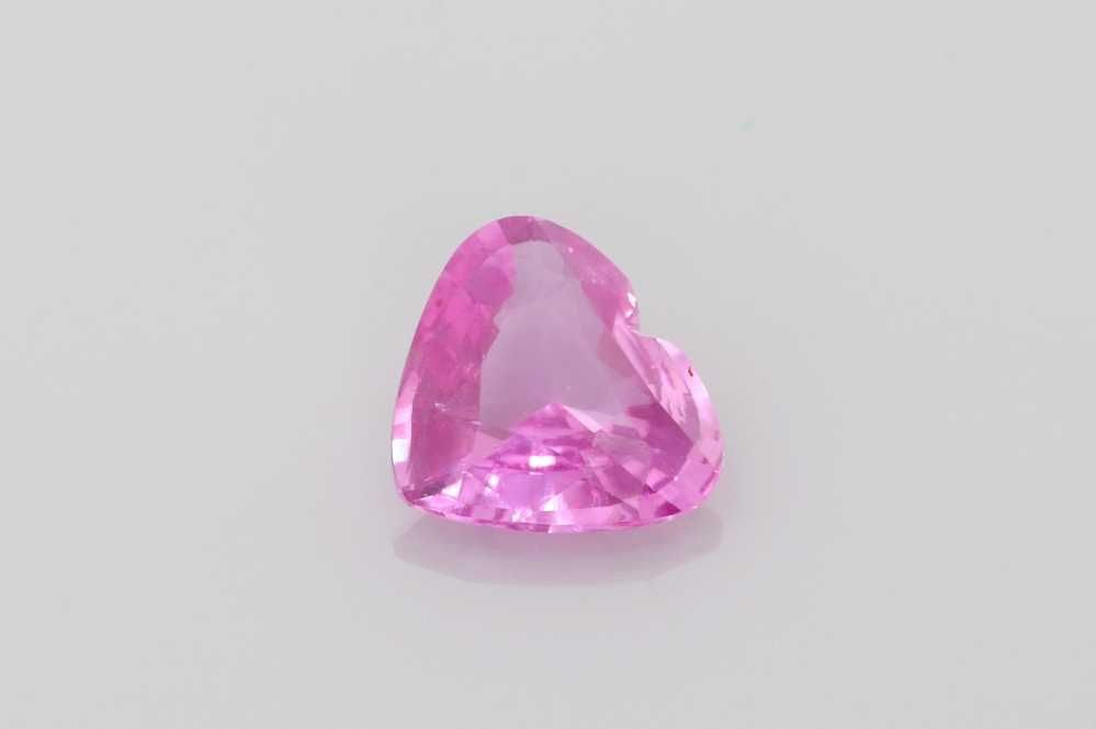 Loose Sapphire Gemstone Heart 1.58ct Pink EC: Loose Sapphire Gemstone Heart 1.58ct Pink EC This Loose Sapphire gemstone is a 1.58ct heart-shaped stone with a vivid pink color and EC clarity, and has been heated for treatment. Item Specifics: