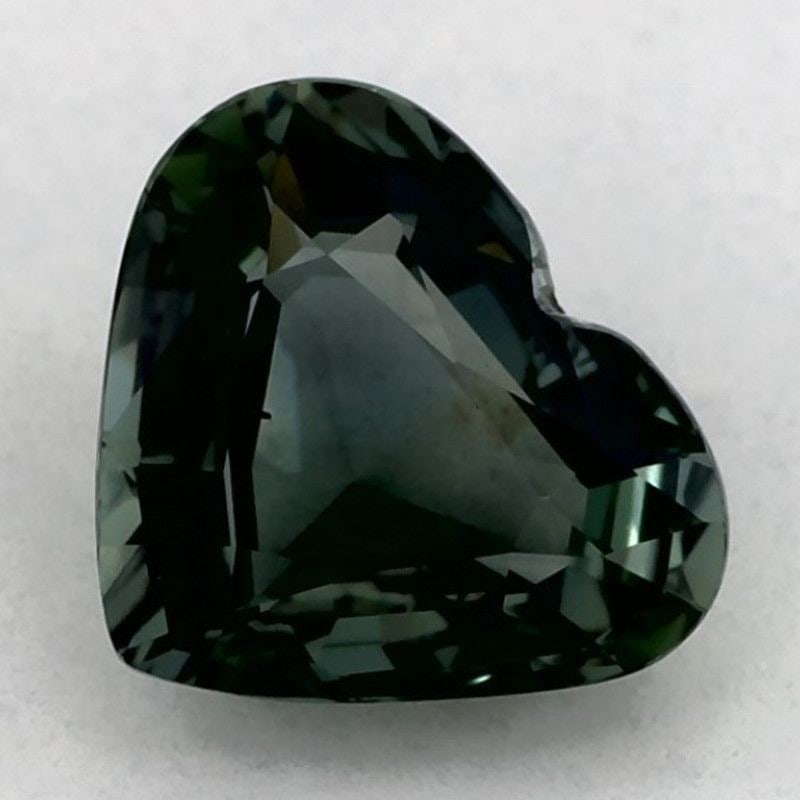 Loose Sapphire Gemstone 1.04ct Green SI - Heart: Loose Sapphire Gemstone 1.04ct Green SI - Heart Loose sapphire gemstone with a carat weight of 1.04, featuring a heart cut, green color, and SI clarity, measuring 5.94mm by 7.02mm. This gemstone has