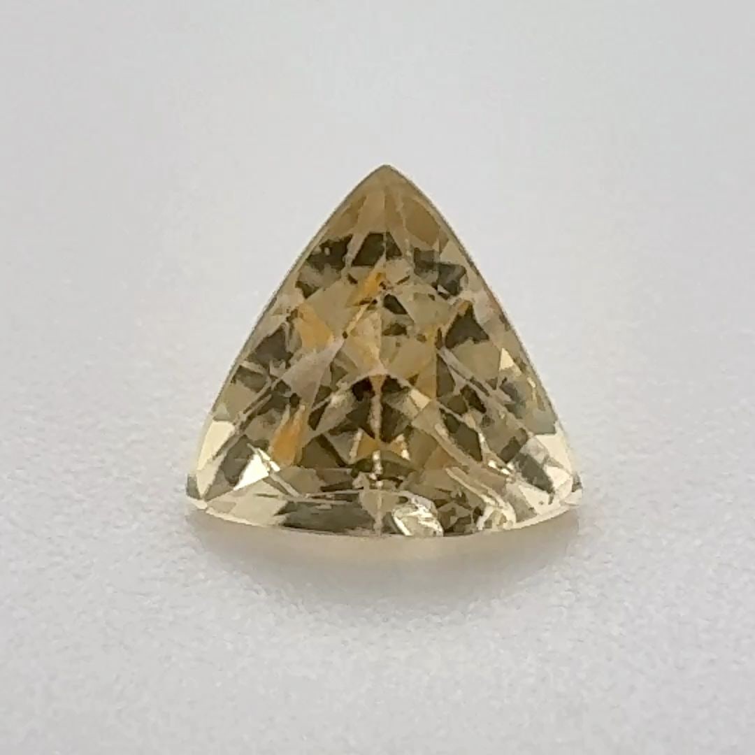 Loose Topaz Gemstone Trilliant 1.0ct Yellow SI: Loose Topaz Gemstone Trilliant 1.0ct Yellow SI Loose topaz gemstone in trilliant cut weighing 1.0ct, yellow color with SI clarity, measuring 6.0L x 6.33W; no certification. Item Specifics: Type: