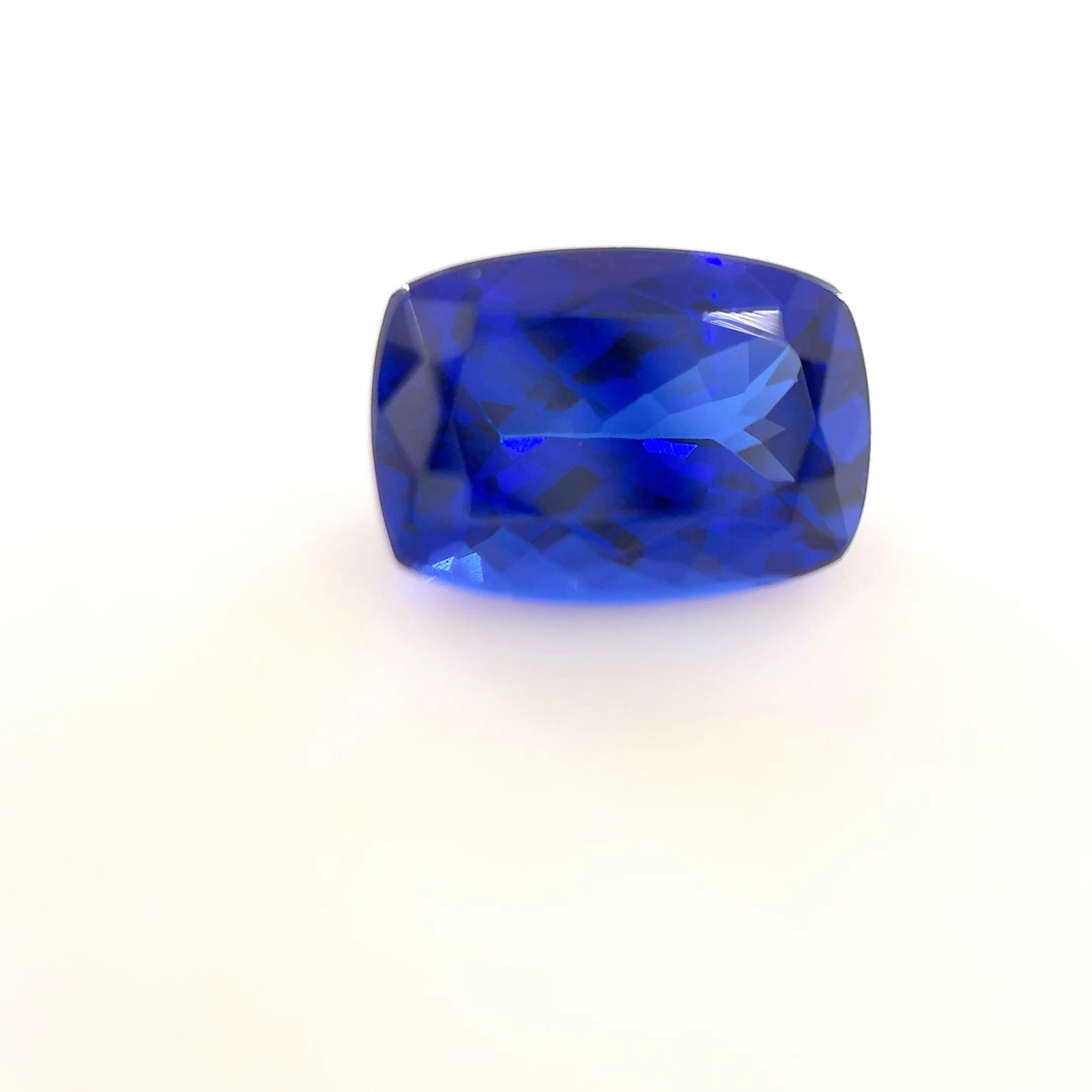 Loose Tanzanite Gemstone Cushion 1.92ct Blue EC: Loose Tanzanite Gemstone Cushion 1.92ct Blue EC Loose Lab Diamond IGI Cushion Brilliant 1.55ct E VVS2, polished and symmetrical with dimensions of 6.67L x 6.54W x 4.48H mm. Certified by IGI. Item