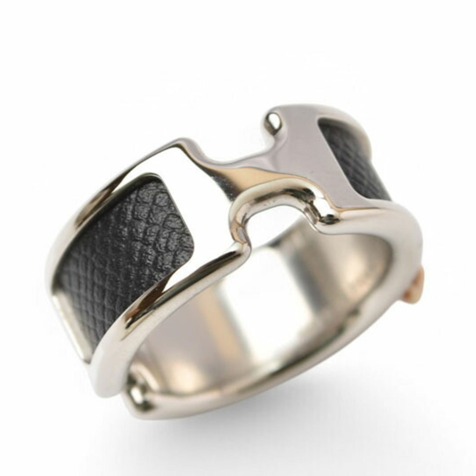 Leather and Metal Band Ring by Hermes: Leather and Metal Band Ring by Hermes This Hermes band ring for women is crafted from leather and metal, is black and silver in color, size 6.5, and is in mint condition. Item Specifics: Brand: