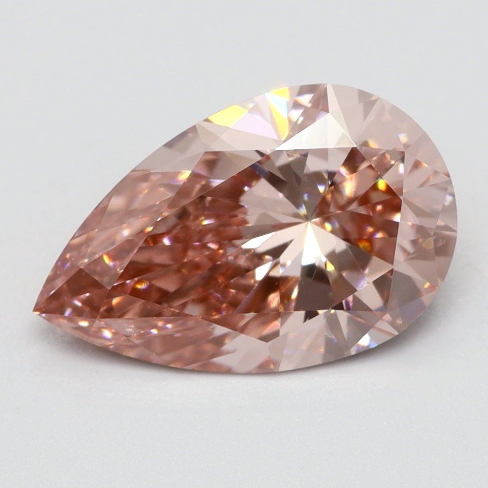 Loose Lab Diamond Pear 1.1ct Fancy Vivid Pink VS2: Loose Lab Diamond Pear 1.1ct Fancy Vivid Pink VS2 Loose lab-grown diamond, pear cut, weighing 1.1ct, fancy vivid pink color, VS2 clarity, and no certification, measuring 9.25L x 5.8W x 3.35H. Item