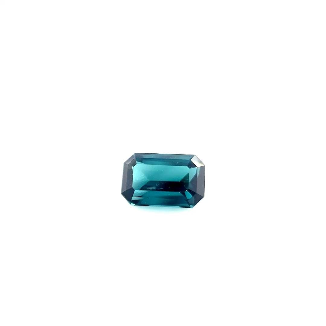 Loose Tourmaline Gemstone 1.92ct Blue Emerald SI: Loose Tourmaline Gemstone 1.92ct Blue Emerald SI This loose 1.92ct blue tourmaline gemstone, color Indicolite, is faceted with SI clarity and has measurements of 8.8L x 5.7W. It comes without