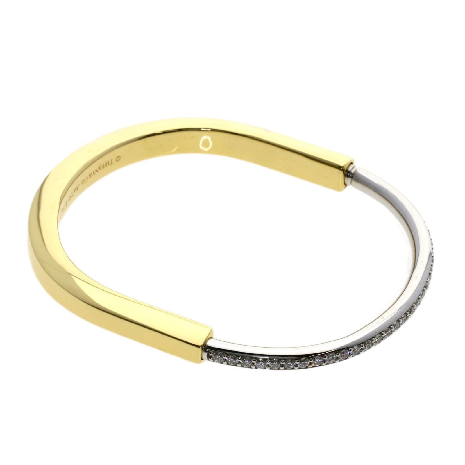 Tiffany Bangle 18K White Gold, 18K Yellow Gold: Tiffany Bangle 18K White Gold, 18K Yellow Gold Tiffany bangle made of 18K white and yellow gold, 18cm in length, in like new condition with minimal signs of wear. Item Specifics: Brand: Tiffany