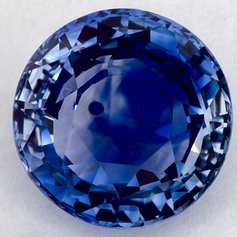 Loose Sapphire Gemstone Round 2.17ct Blue SI: Loose Sapphire Gemstone Round 2.17ct Blue SI Loose Sapphire gemstone weighing 2.17ct in blue color with SI clarity, featuring a faceted cut and treated by heating, measuring 7.53L x 7.53W. Item