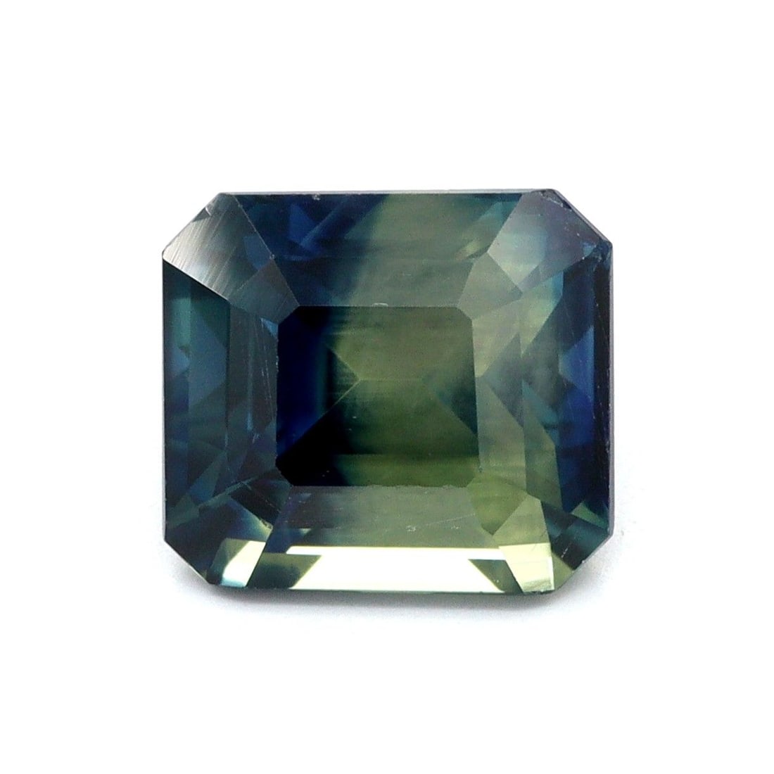 Loose Sapphire Gemstone Emerald 2.08ct Multi_Color EC: Loose Sapphire Gemstone Emerald 2.08ct Multi_Color EC Loose sapphire gemstone weighing 2.08ct, multi-color with EC clarity, heated treatment, and faceted cut. Measurements are 7.16L x 6.46W mm. Item S