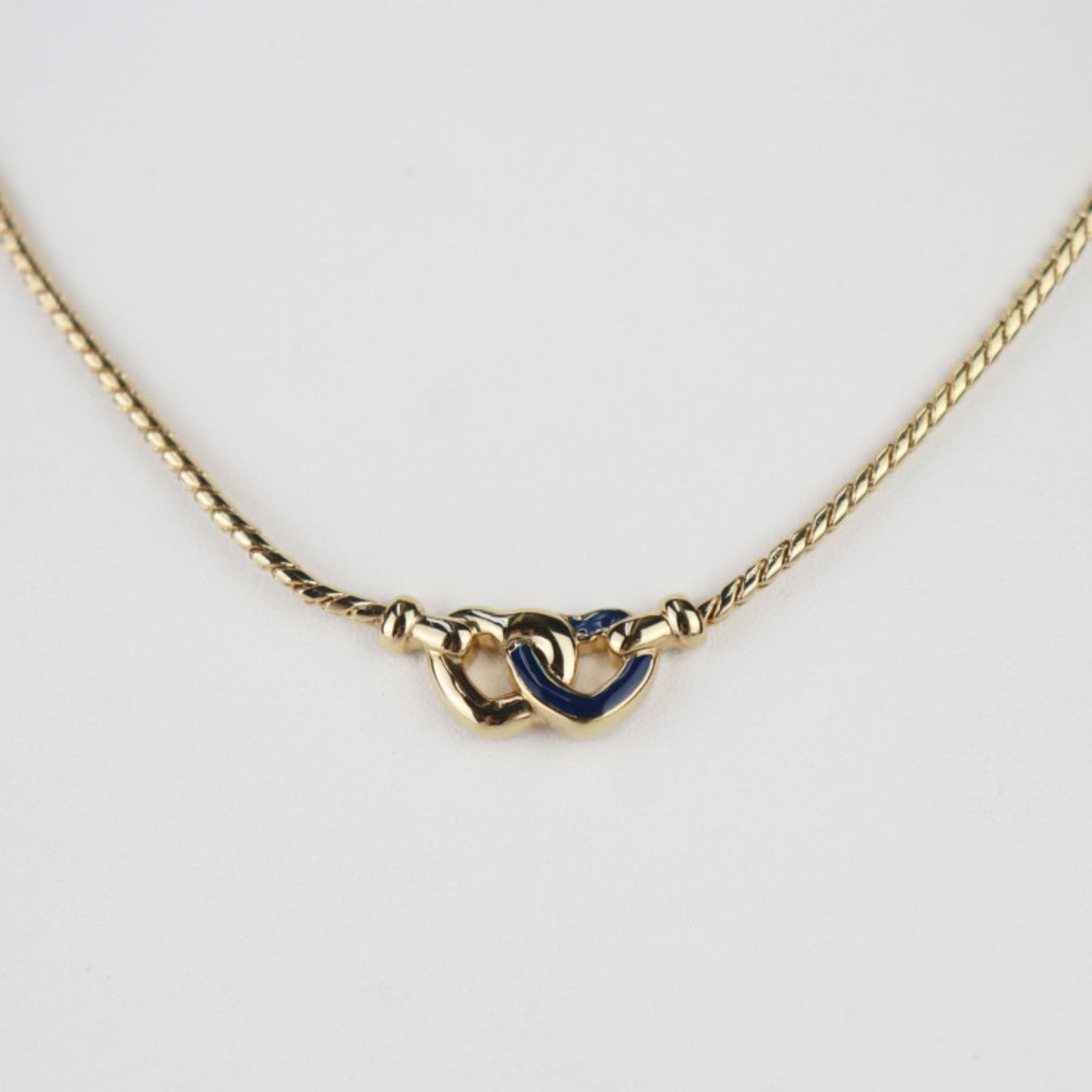 Metal Christian Dior: Metal Christian Dior Christian Dior gold and navy metal pendant necklace for women, measuring 44 cm in circumference with a pendant size of 9mm x 22mm, in like-new used condition. Item Specifics: