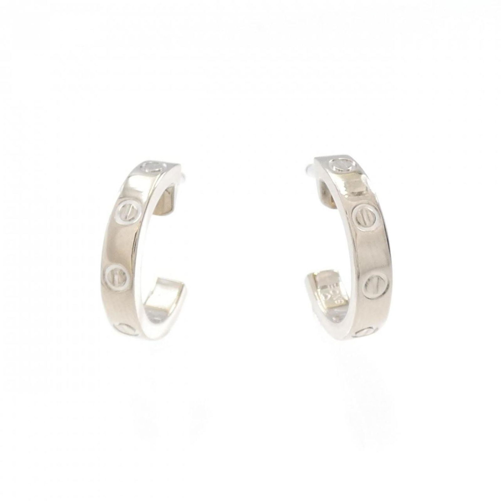 White Gold (18K) Cartier Stud Earrings: White Gold (18K) Cartier Stud Earrings Cartier stud earrings made of 18K white gold, sized 12.10mm x 2.40mm, described as used but like new with minimal traces of usage. Item Specifics: Brand: Cartier
