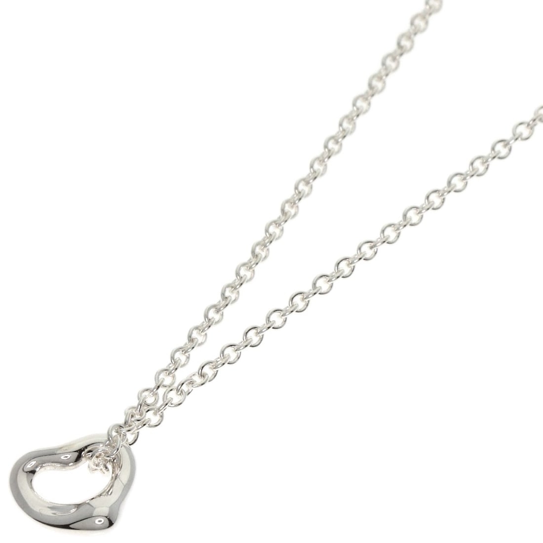 Silver TIFFANY&Co. Open Heart Mini Necklace: Silver TIFFANY&Co. Open Heart Mini Necklace This loose sapphire gemstone weighs 1.57ct, has a white faceted cut with EC clarity, and shows no treatment. Item Specifics: Brand: TIFFANY&Co. Style: