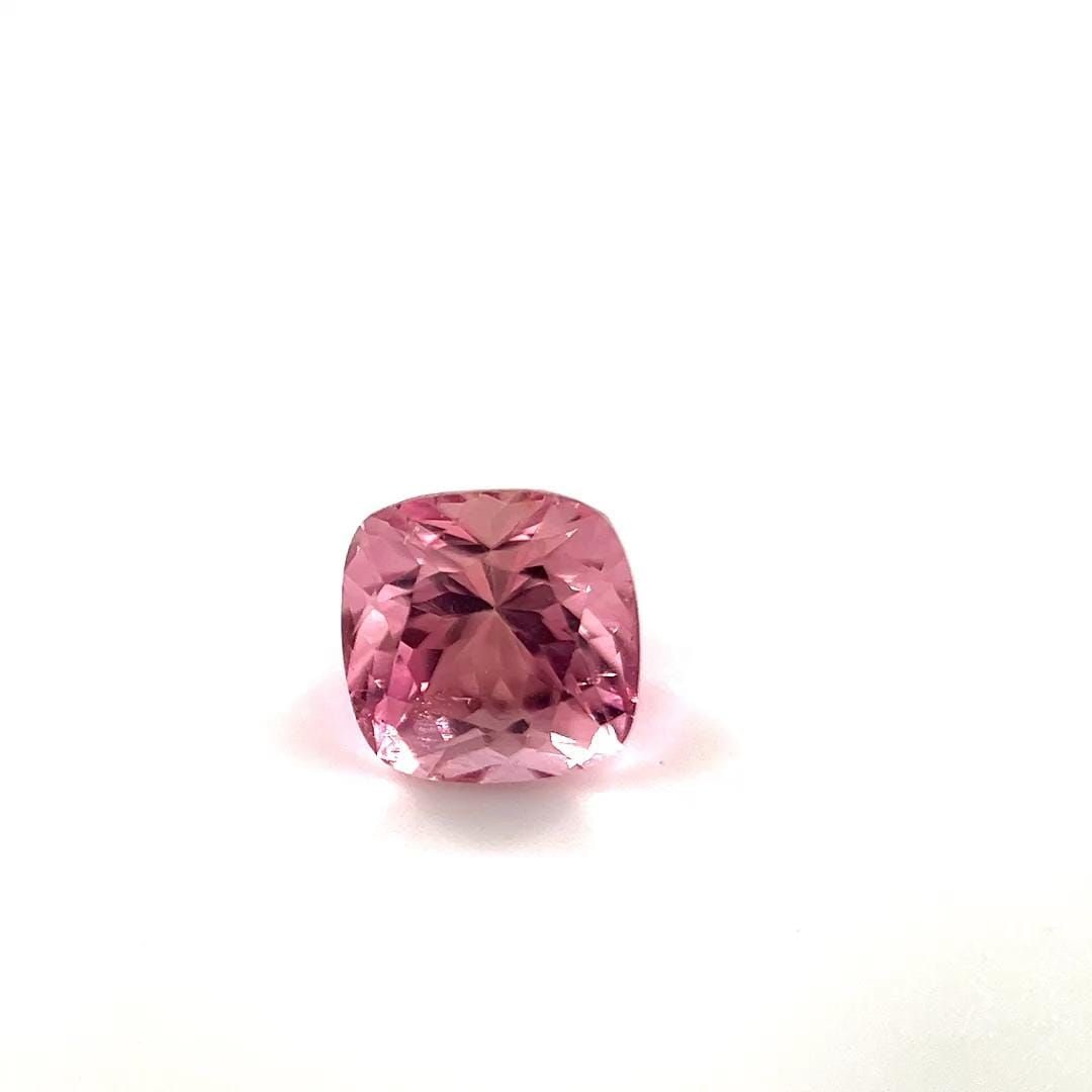 Loose Tourmaline Gemstone Cushion 1.19ct Pink SI: Loose Tourmaline Gemstone Cushion 1.19ct Pink SI A 1.19ct Loose Tourmaline Gemstone in a peachy pink color, faceted and with SI clarity, measuring 6.1L x 6.1W. Item Specifics: Type: Tourmaline