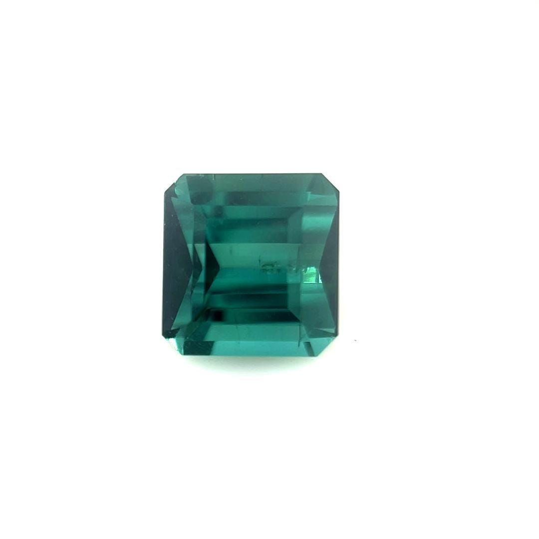 Loose Tourmaline Gemstone - 1.47ct Blue Emerald SI: Loose Tourmaline Gemstone - 1.47ct Blue Emerald SI Loose Tourmaline gemstone weighing 1.47ct, featuring a peacock teal blue color and SI clarity, with faceted cut and no treatment. Measurements are 6.