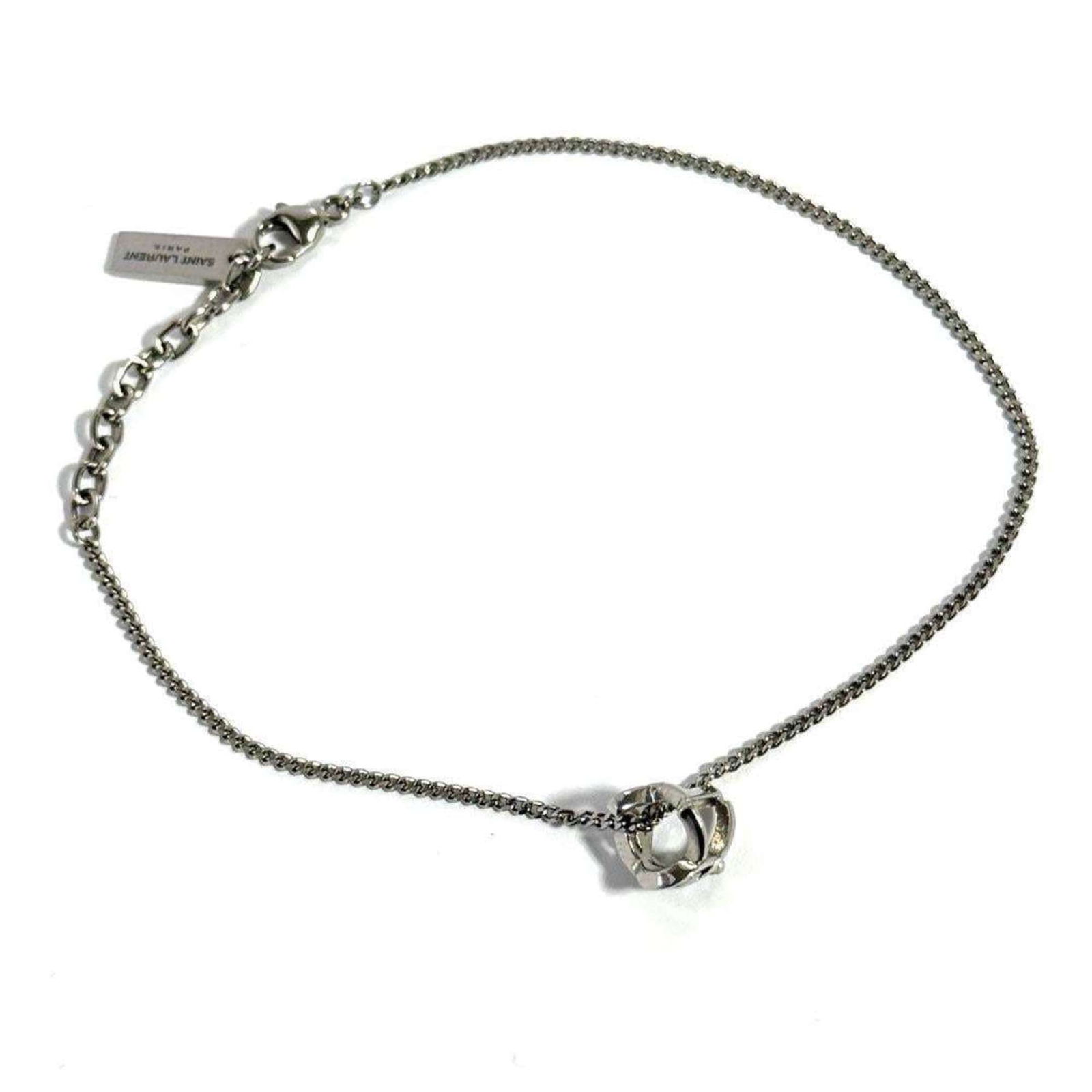 Metal Saint Laurent Charm Bracelet: Metal Saint Laurent Charm Bracelet This metal charm bracelet from Saint Laurent is adjustable from 18.5cm to 21cm in length and is in very good used condition. Item Specifics: Brand: Saint Laurent