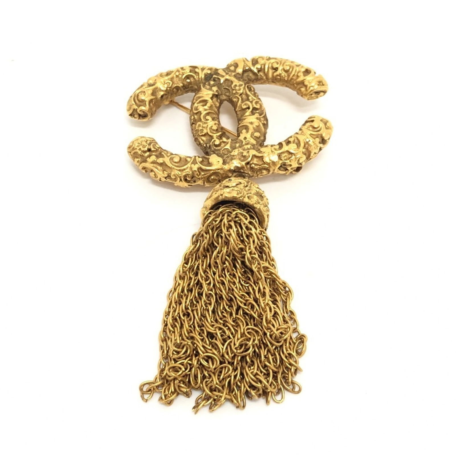 Chanel Metal Brooch: Chanel Metal Brooch Chanel metal brooch for women, colored gold, measuring 30cm x 43cm. The item is used, in good condition, with some signs of wear including scratches and dirt. Item Specifics:
