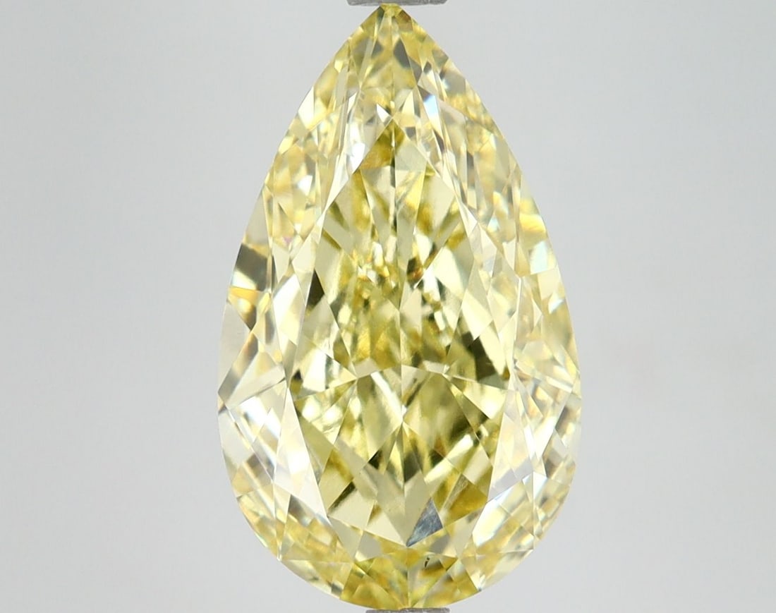 Loose Lab Diamond 4.53ct Pear Fancy Vivid Yellow VS1: Loose Lab Diamond 4.53ct Pear Fancy Vivid Yellow VS1 Loose lab-grown diamond, 4.53ct pear cut, fancy vivid yellow color with VS1 clarity, measuring 14.2L x 8.43W x 5.09H, certified by IGI. Item