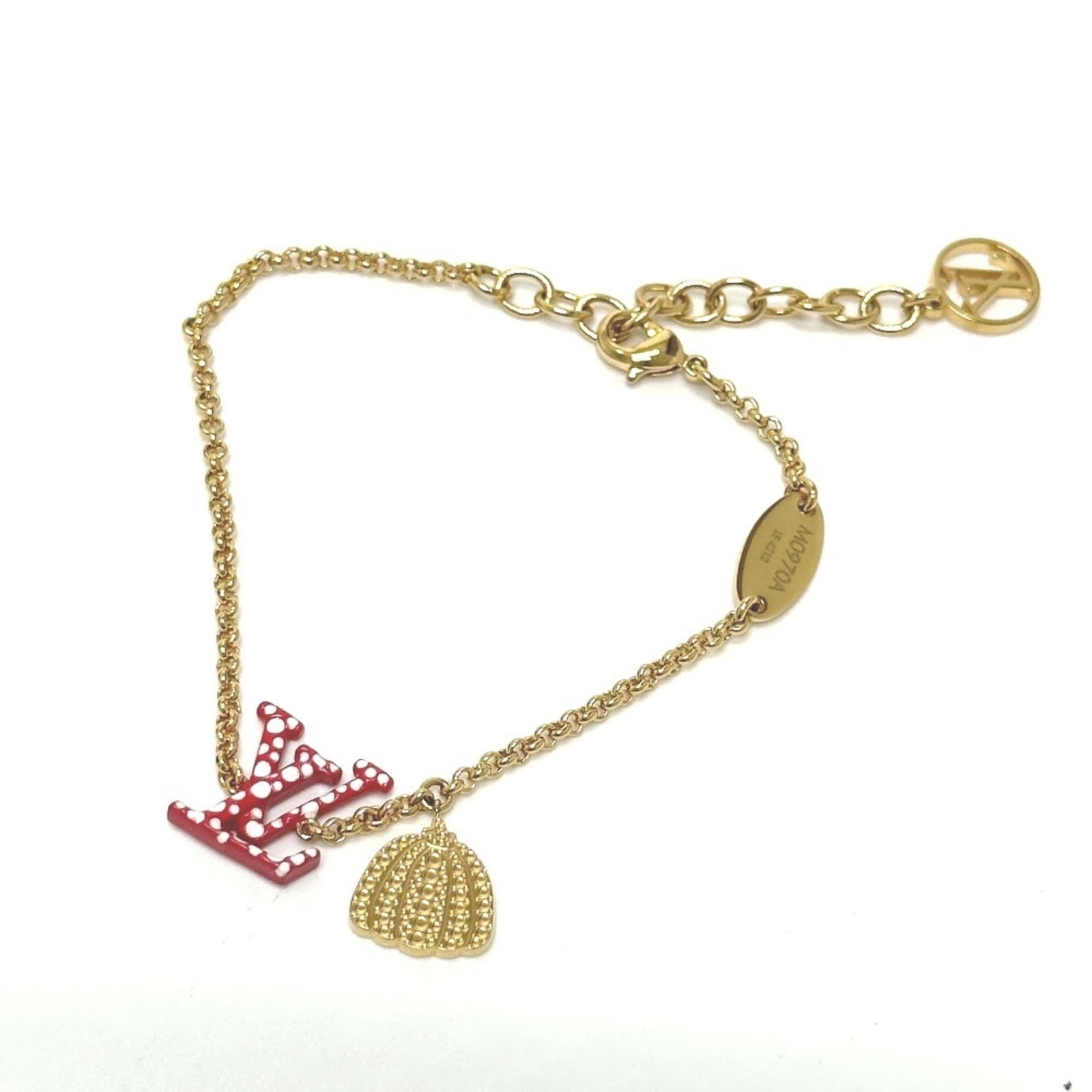 Louis Vuitton Metal Charm Bracelet: Louis Vuitton Metal Charm Bracelet Louis Vuitton gold and red metal charm bracelet, opened but never used, designed for women. Item Specifics: Brand: Louis Vuitton Type: Charm Bracelet Gender: Women