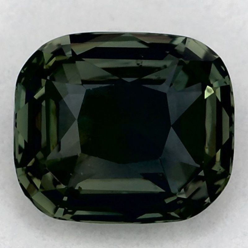 Loose Sapphire Gemstone Cushion 1.03ct Green EC: Loose Sapphire Gemstone Cushion 1.03ct Green EC Loose Sapphire gemstone Cushion 1.03ct Green EC with a faceted cut, heated treatment, and measurements of 5.95L X 5.15W. Certification is not