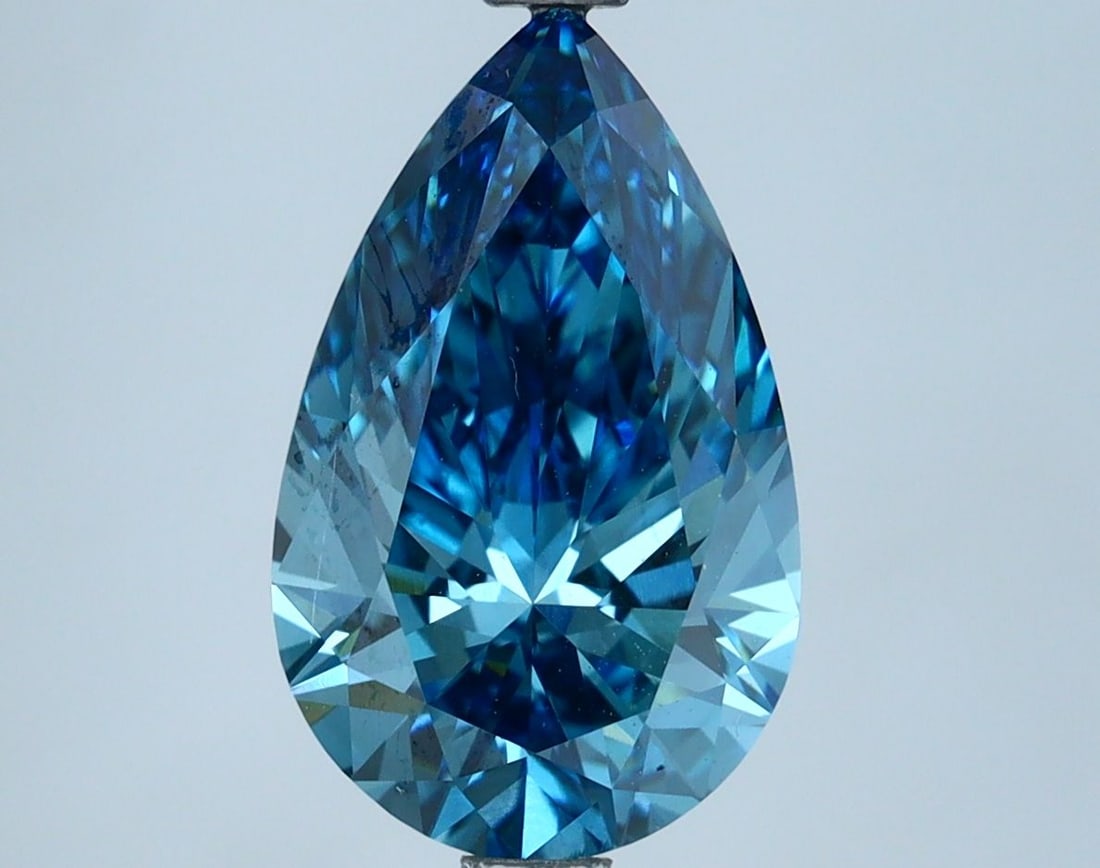 Loose Lab Diamond IGI Pear 2.86ct Fancy Vivid Blue VVS2: Loose Lab Diamond IGI Pear 2.86ct Fancy Vivid Blue VVS2 Loose lab-grown diamond weighing 2.86ct with Fancy Vivid Blue color and VVS2 clarity, certified by IGI, measuring 12.7L x 7.78W x 4.86H. Item