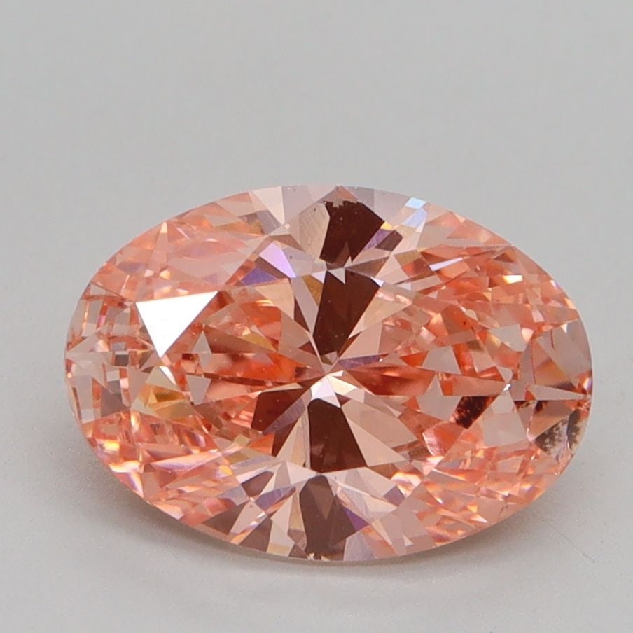 Loose Lab Diamond IGI Oval 2.03ct Fancy Vivid Pink VS2: Loose Lab Diamond IGI Oval 2.03ct Fancy Vivid Pink VS2 Loose Lab Diamond weighing 2.03ct, oval cut with Fancy Vivid Pink color and VS2 clarity, certified by IGI. Measurements are 10.07L x 7.14W x 4.38